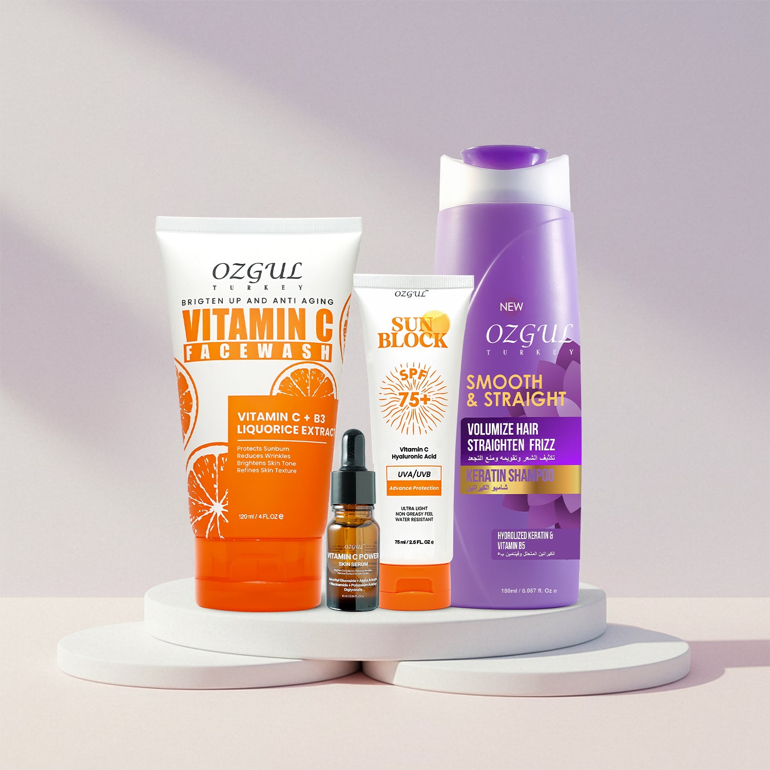 Collection of OZGUL skincare and hair care products on a white background