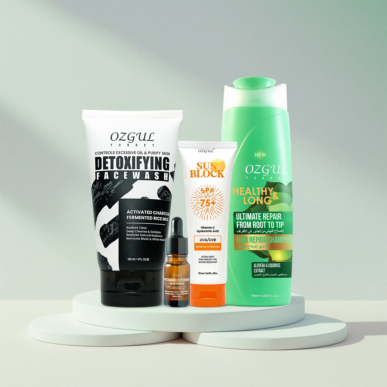 Collection of Ozgul skincare and hair care products on a white background
