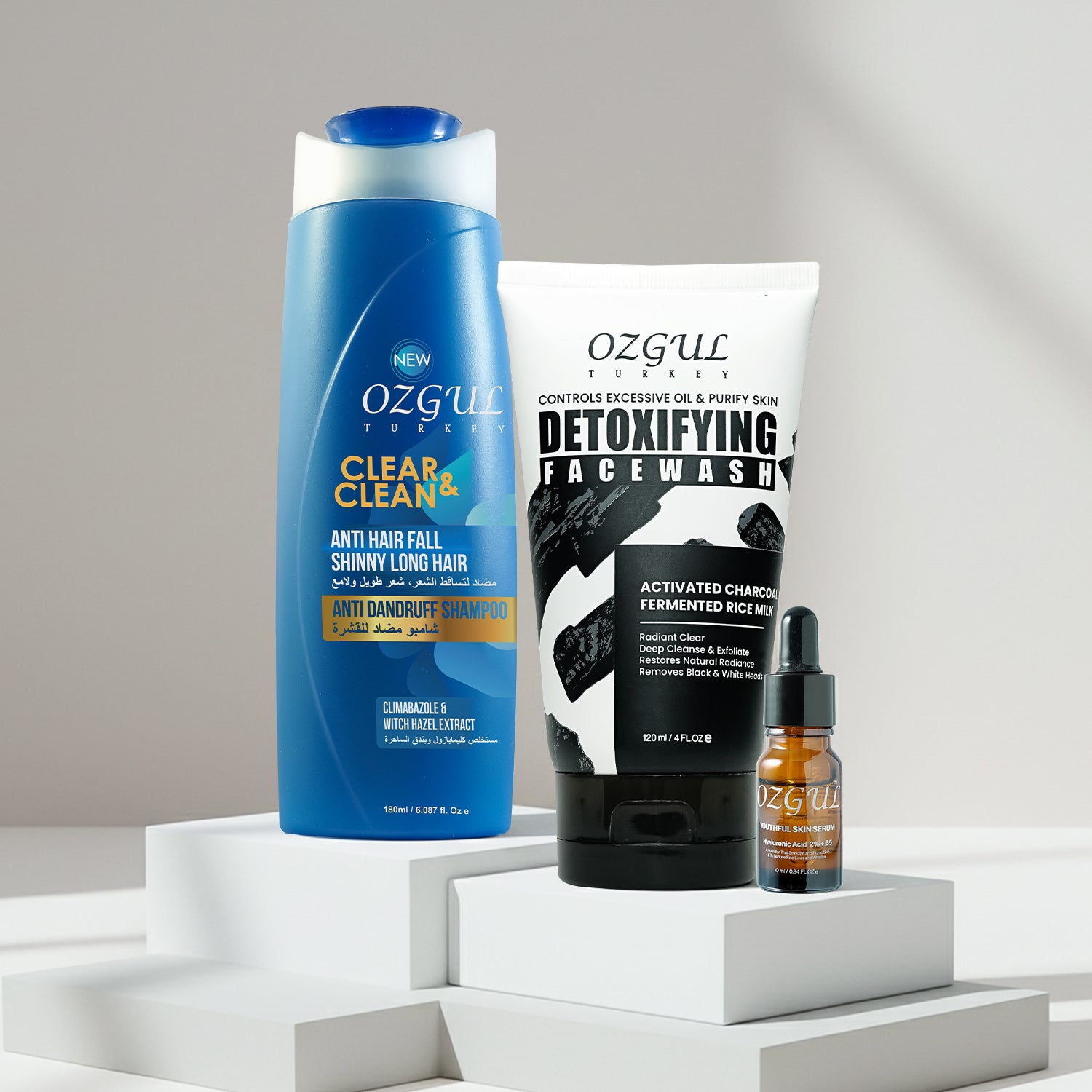 Ozgul skincare products including shampoo, face wash, and serum on a white background